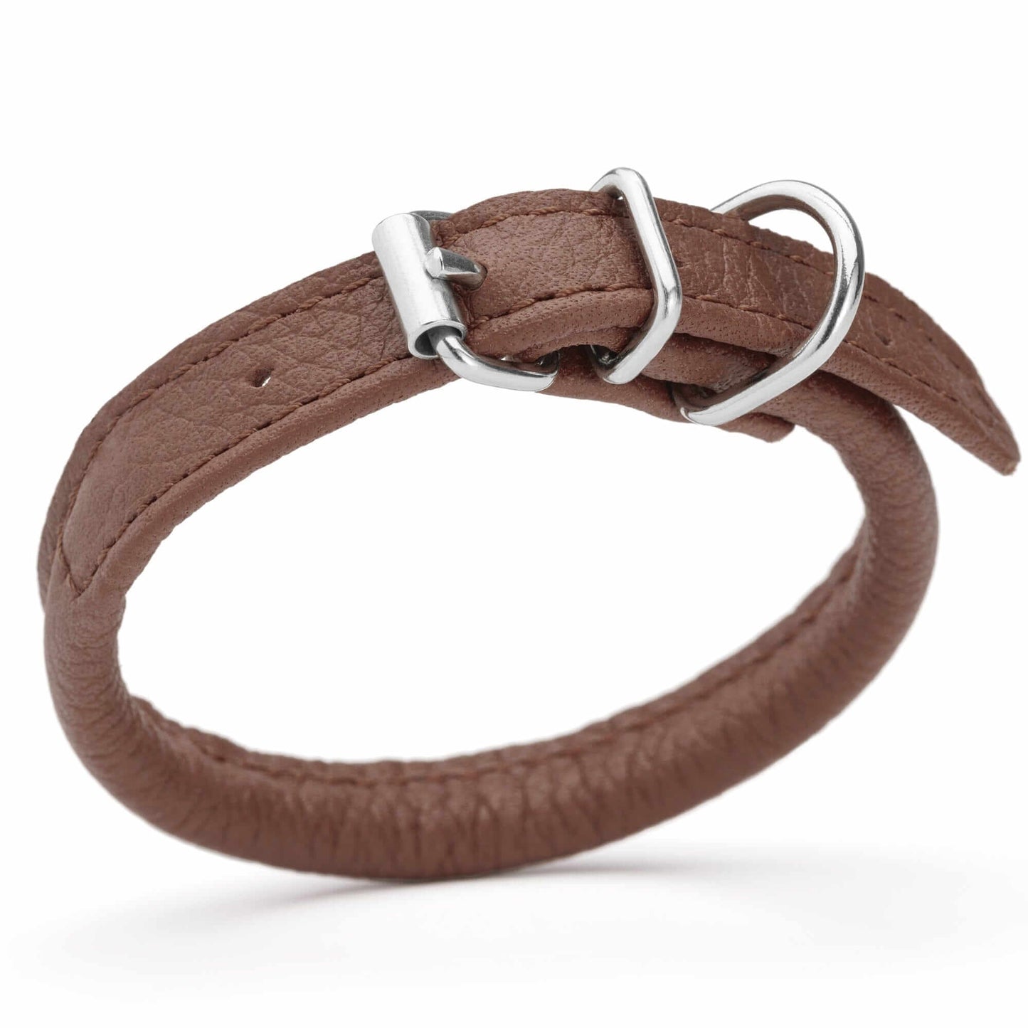 Dog wearing a white soft leather round collar sitting in the park with owner
