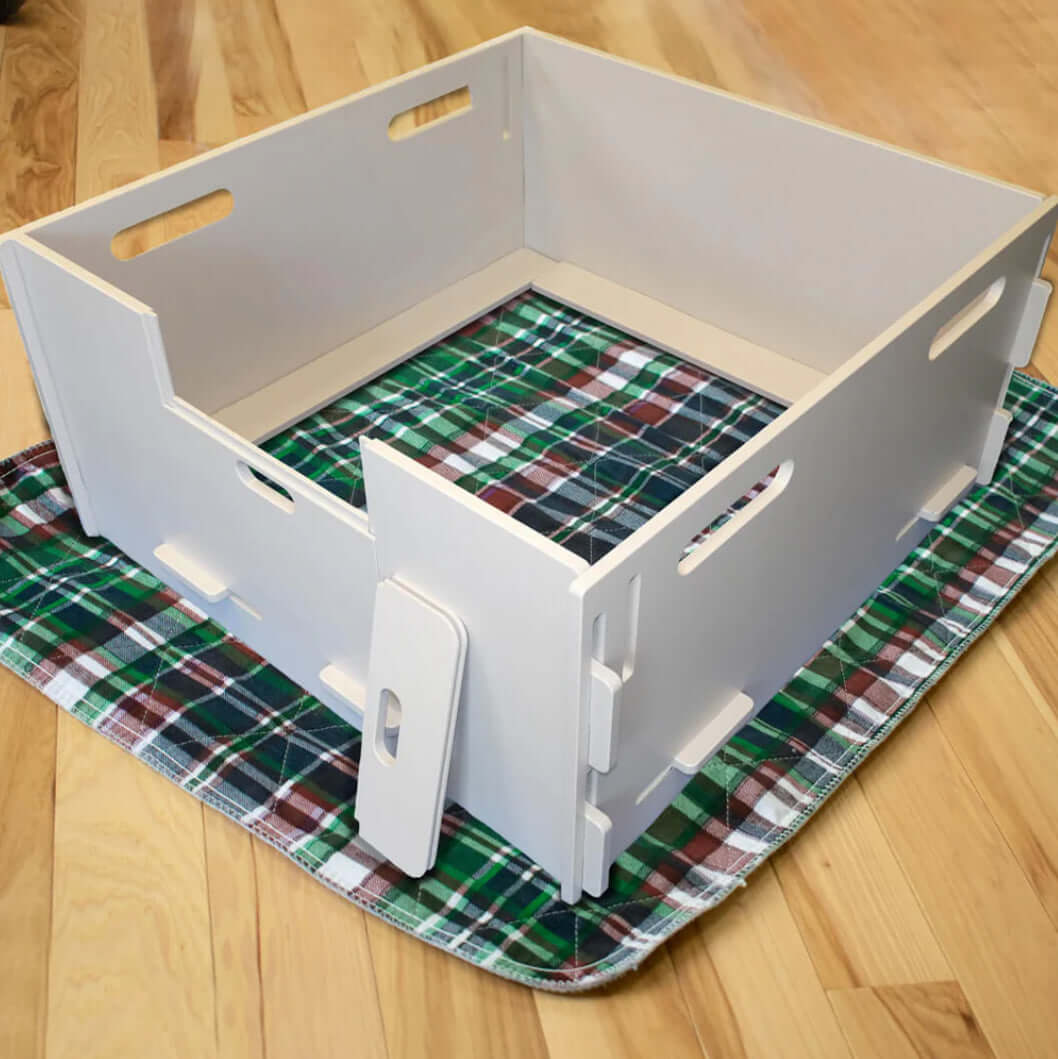 A whelping box for dogs, designed with soft bedding and high sides to provide a safe and comfortable space for a mother dog to give birth and care for her puppies.