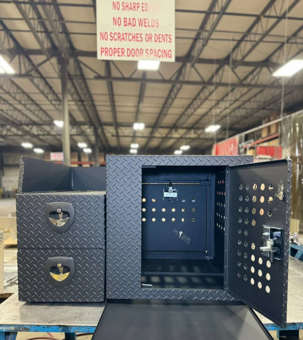 Owen's Professional K9 Deployment Unit displayed inside a warehouse, showing secure compartments for working dogs and tactical gear