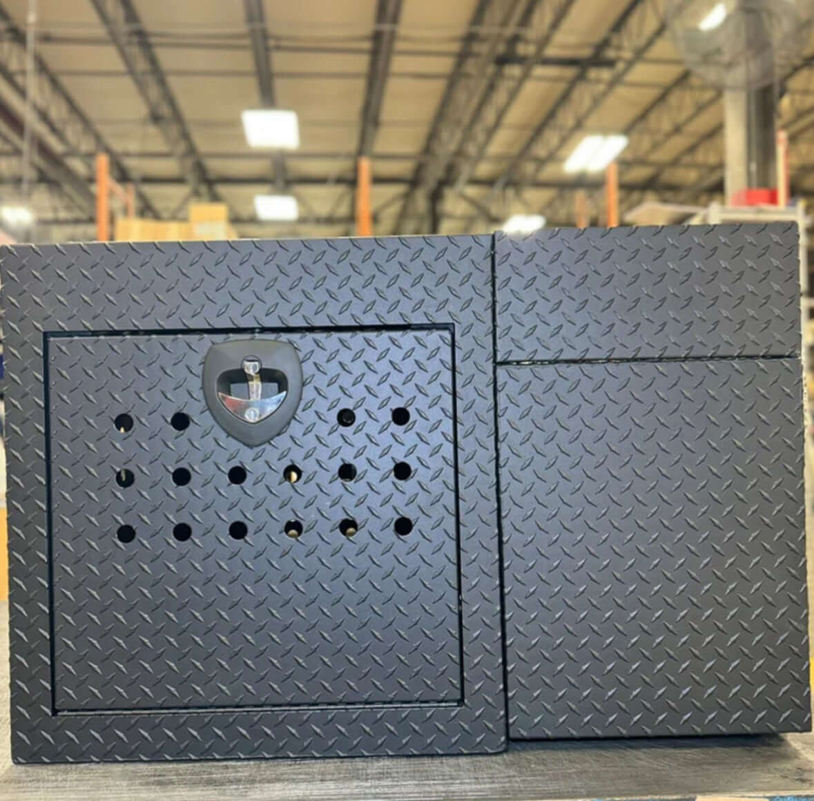 Owen's Professional K9 Deployment Unit displayed inside a warehouse, showing secure compartments for working dogs and tactical gear