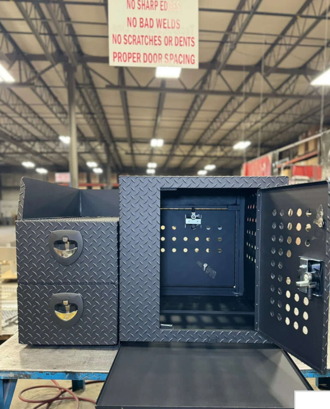 Owen's Professional K9 Deployment Unit displayed inside a warehouse, showing secure compartments for working dogs and tactical gear