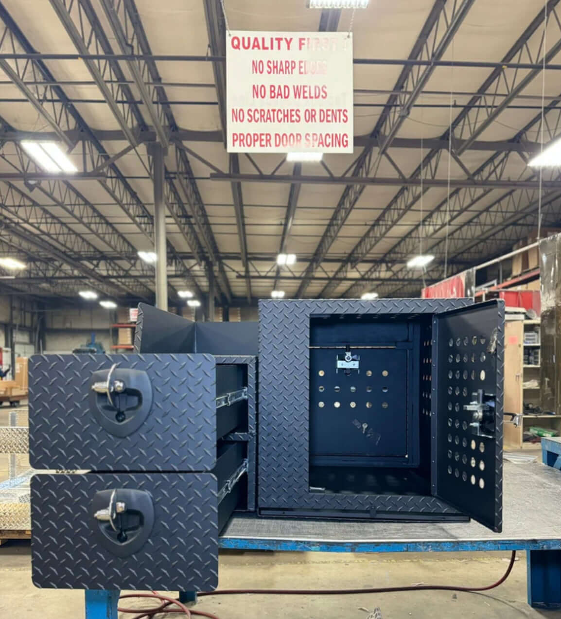 Owen's Professional K9 Deployment Unit displayed inside a warehouse, showing secure compartments for working dogs and tactical gear