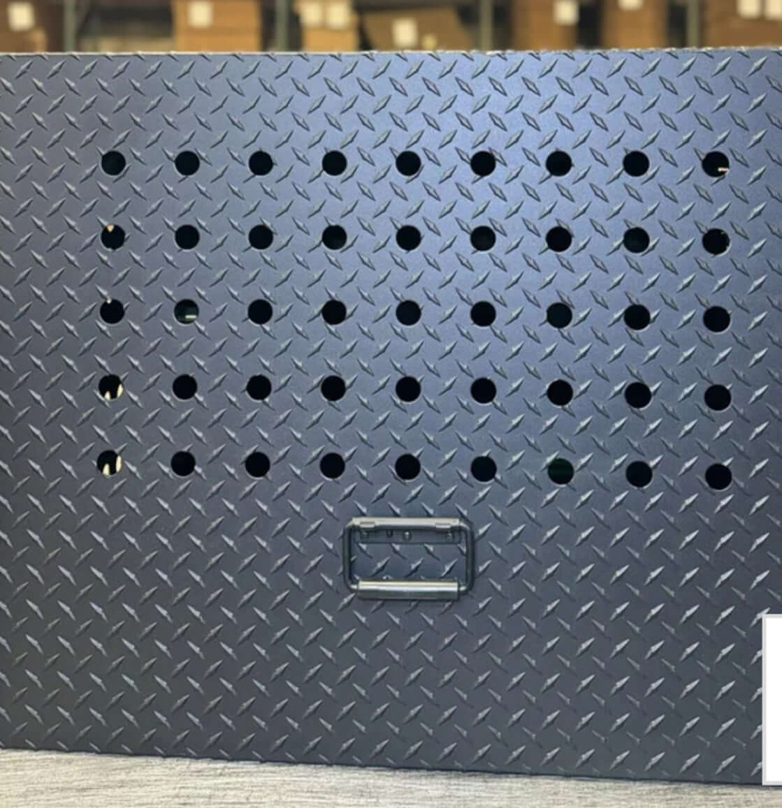 Owen's Professional K9 Deployment Unit displayed inside a warehouse, showing secure compartments for working dogs and tactical gear