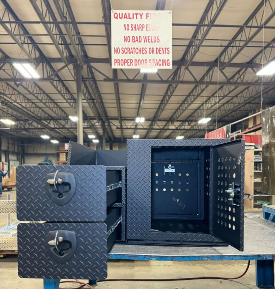 Owen's Professional K9 Deployment Unit displayed inside a warehouse, showing secure compartments for working dogs and tactical gear