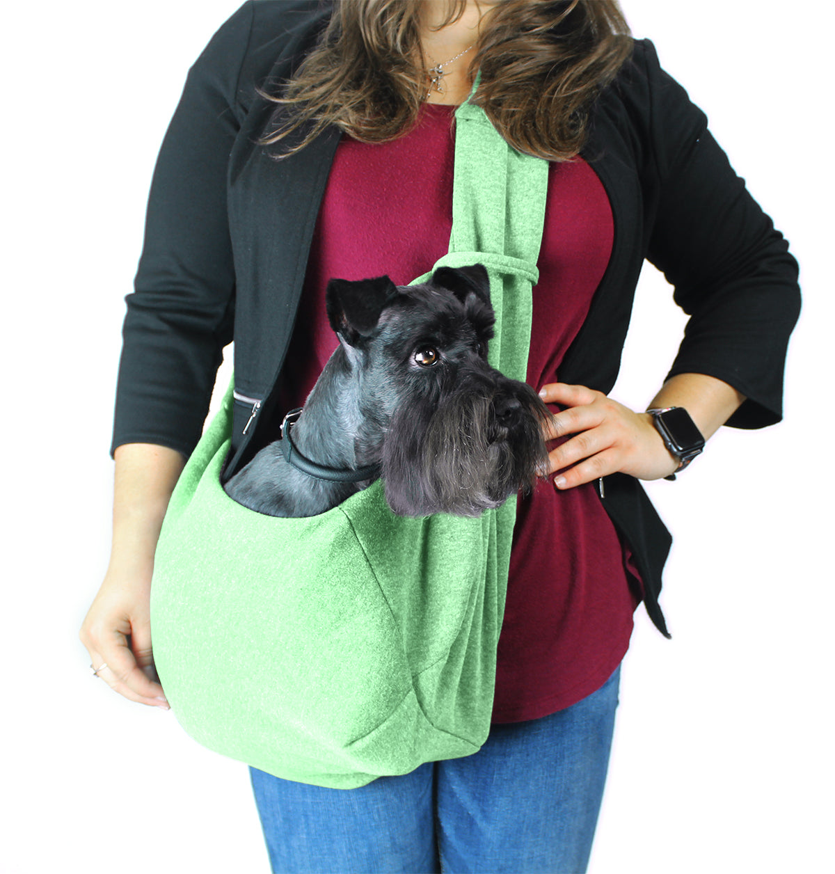 A girl wearing a Comfortable pet slings with her dog in it great for for carrying small dogs and cats – hands-free, adjustable, and stylish pet carriers