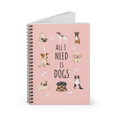 Notebook with dog illustrations and text 'All I Need is Dogs' on a pink background