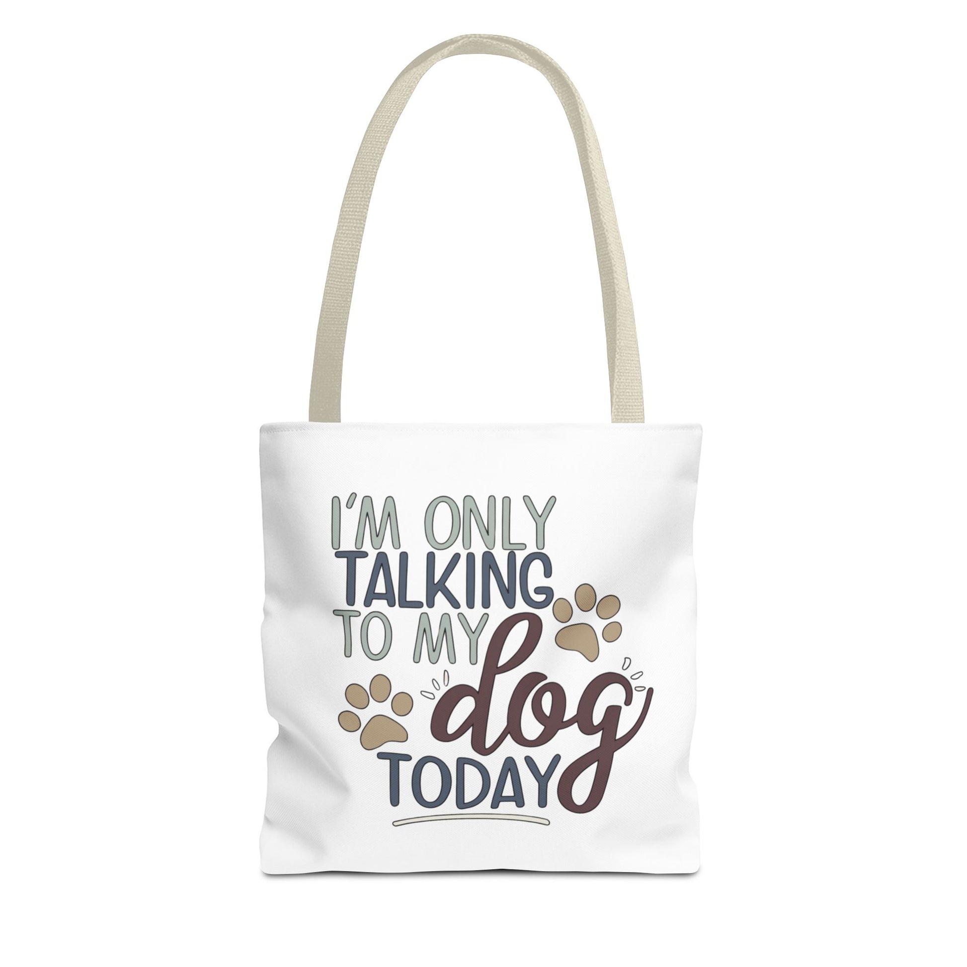 Tote bag with 'I'm only talking to my dog today' text and paw prints on a white background