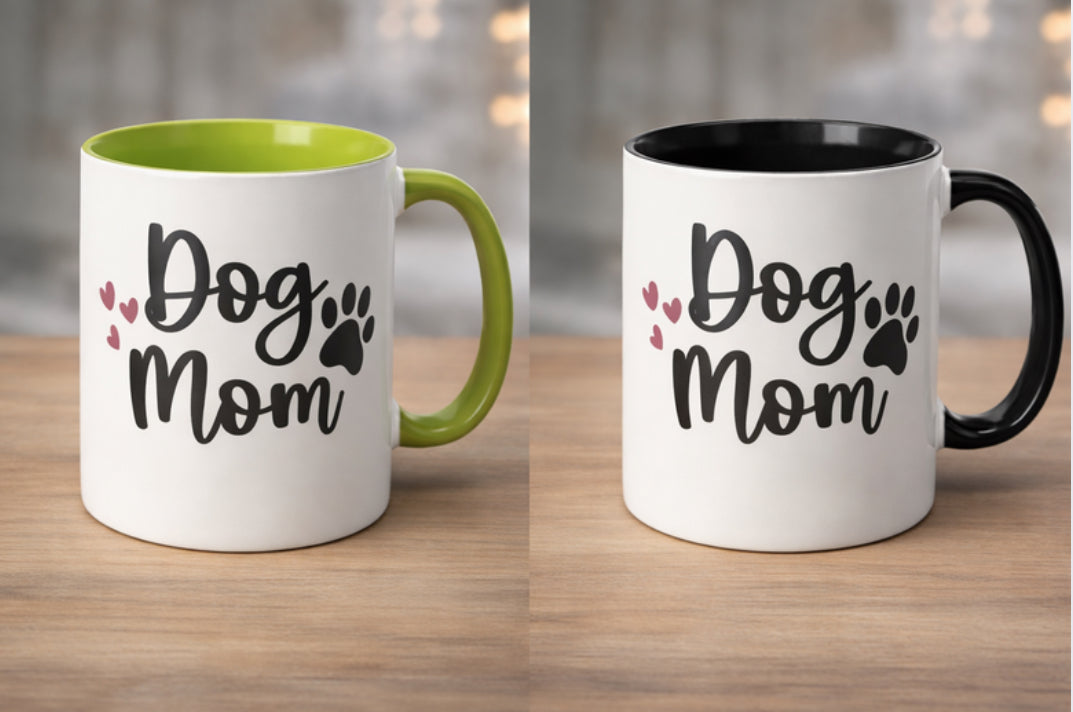 Two mugs with 'Dog Mom' text on a wooden surface