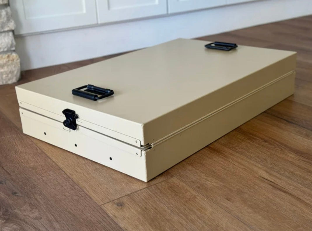 Heavy-duty collapsible K9 crate folded flat for police and military dog transport