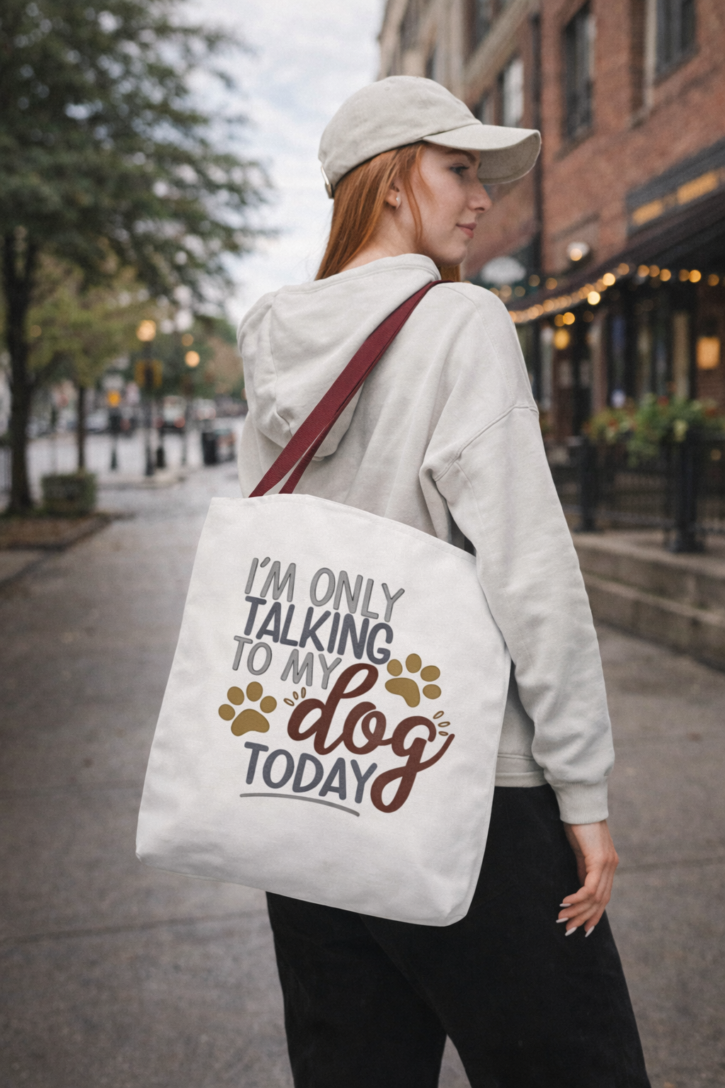 woman in city wearing “I’m Only Talking to My Dog Today” dog lover tote bag over shoulder