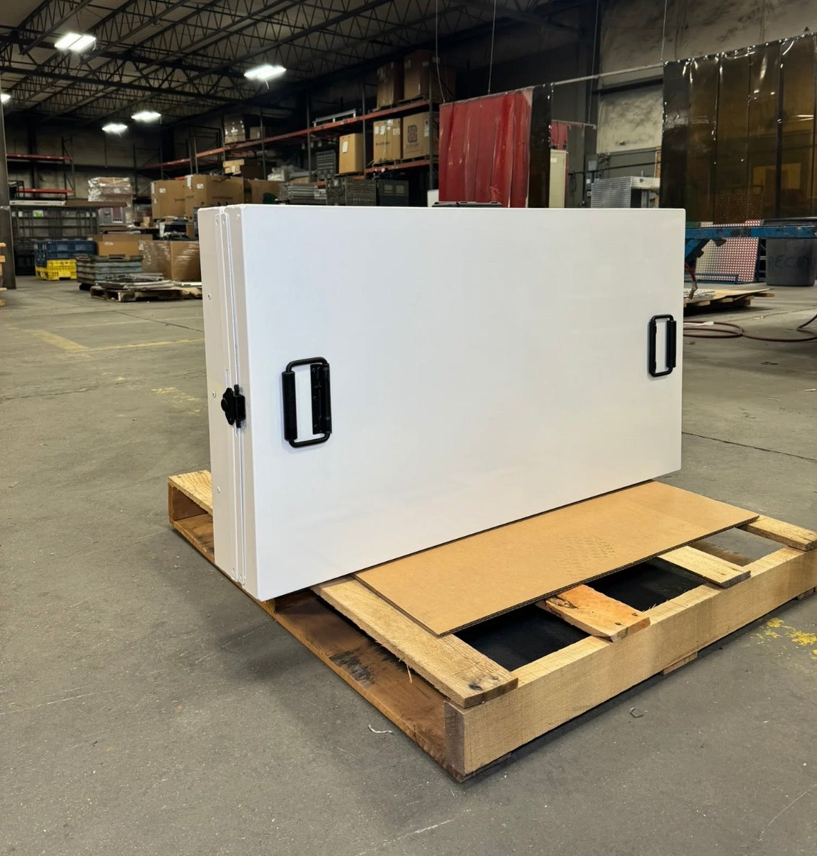 Collapsible aluminum dog crate shown folded for quick setup and breakdown for working dogs, hunting dogs, police dogs, military dogs.