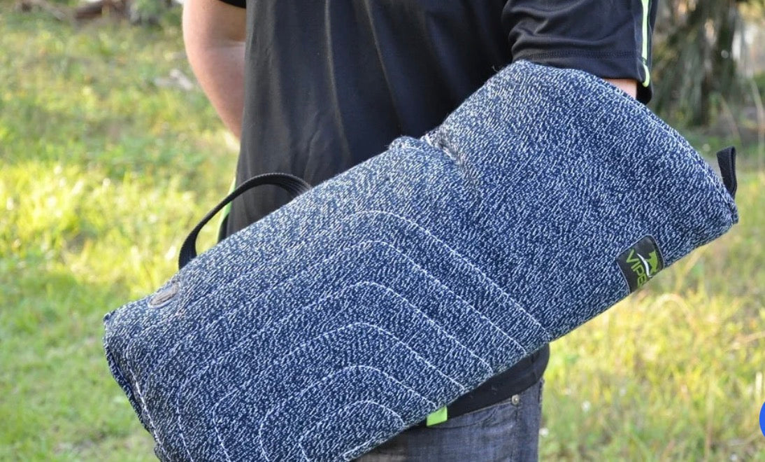 man wearing a blue Viper French Linen Puppy Bite Sleeve Level 1 for K9 training
