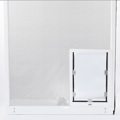 Hale Pet Door for Screen Doors installed in a screen door - white aluminum frame pet door with magnetic closing flap
