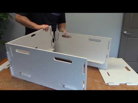 Whelping box with interlocking sides for easy assembly, providing a secure and comfortable space for a mother dog to give birth and care for her puppies.”