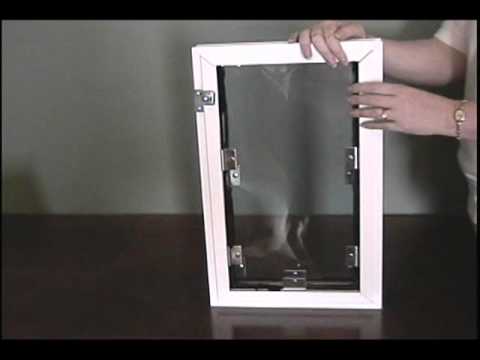 Halie pet door for dogs and cats installed in a standard door, featuring a secure flap and weather-resistant frame for easy pet access 