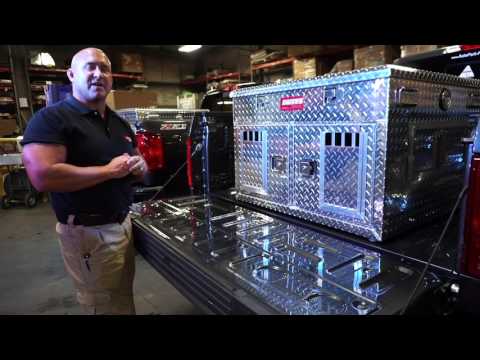 Video of a man showing Owens Dog Box Crate how big it is what it is mad of.  showing how the top storage works